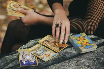 Deep dive into the Four Tarot Suits: Wands, Cups, Swords, and Pentacles. Explore their elemental associations (Fire, Water, Air, Earth) and discover how they represent different realms of life and energy in your readings.